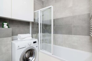 Comfortable bathroom with shower offering a fresh and functional space.