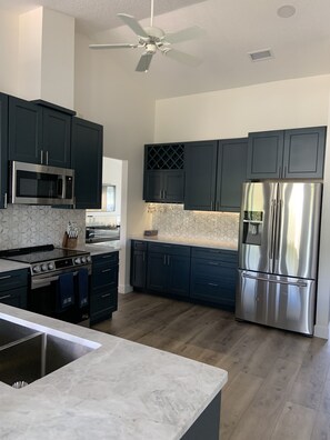Kitchen with stainless steel appliances. 