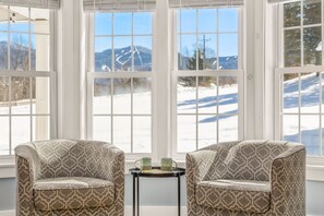 Cozy nook with rotating chairs allows you to sip coffee while taking in the view