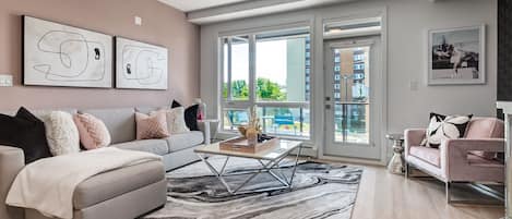 Spacious living room with the door leading to the balcony.
