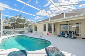 Private screened pool perfect for sunbathing and family fun under the Florida sky.
