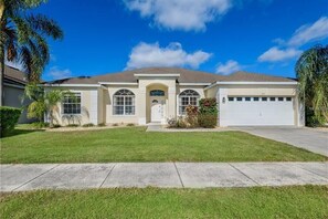 Stunning curb appeal with a welcoming exterior and well-maintained landscaping.