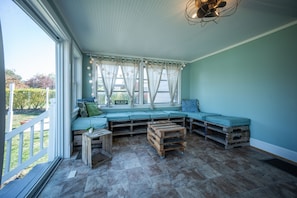 This sun room is just cozy and bright!