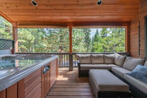 Upstairs balcony with hot tub and seating