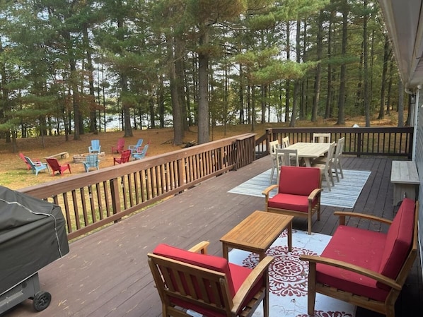 Spacious backyard with deck and firepit. Lots of seating!