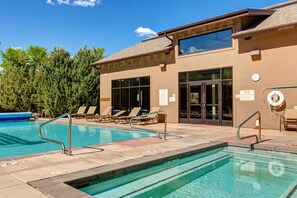 Community Clubhouse with a heated pool and two hot tubs