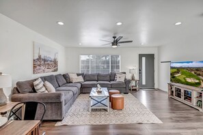 Living Room with Oversized Sectional Seating and Smart TV