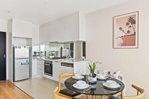 A fully decked kitchen & dining area.