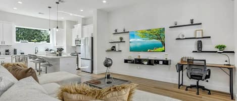 Second Floor Living Room with Large Smart TV with wall art decorations