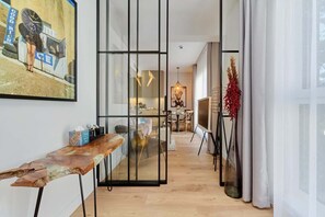 A dining area with an elegant wooden table, chairs, and a decorative setup.
