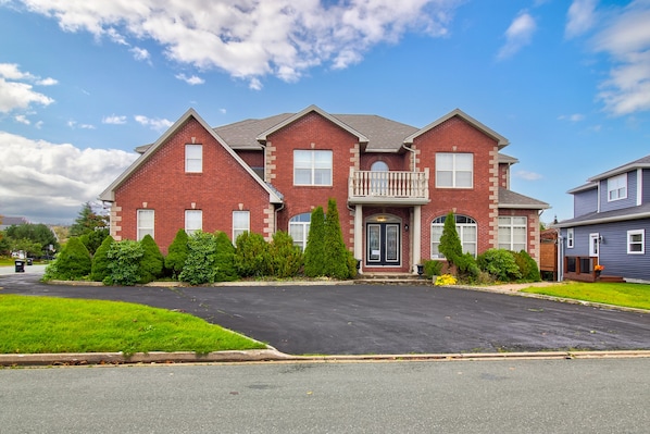 A closer look at our elegant home, adorned with landscaped gardens and a serene neighbourhood backdrop.