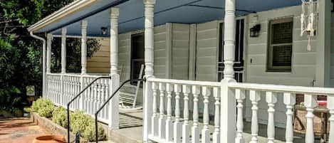 Entrance to home. Wraparound porch.  Great place to enjoy that first cup of Joe.