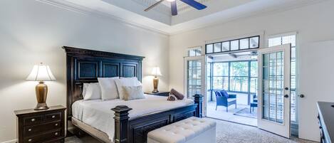 Our first floor master bedroom includes access to a covered patio.