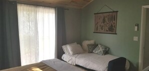 Sofa bed made up and ready for one additional guest (3 guests total allowed).