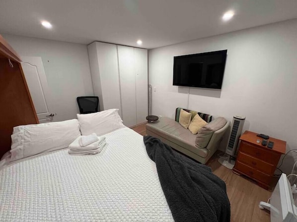 Bedroom with Queen Bed, TV and wardrobe
