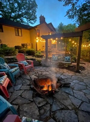 Enjoy swinging by the fire in our secluded backyard.