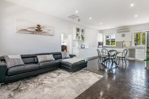 Living, dining and kitchen space.