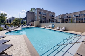 Dive into the weekend with our resort-style swimming pool and comfortable lounge chairs, the perfect spot to unwind after a long day.