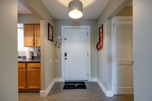 Make your way down this hallway and discover a charming kitchen space filled with the aroma of home-cooked meals.