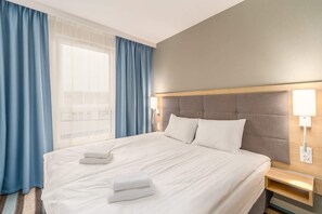 Cosy bedroom with comfortable bed.