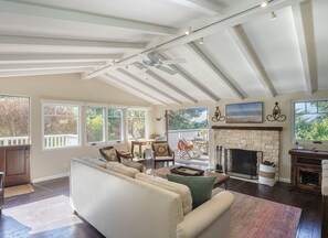 Living Room with Candlelit Fireplace and HDTV