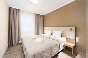 The cosy bedroom features a luxurious double bed and ample storage.