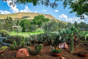 Beautifully landscaped greenery and mesa views from the front deck