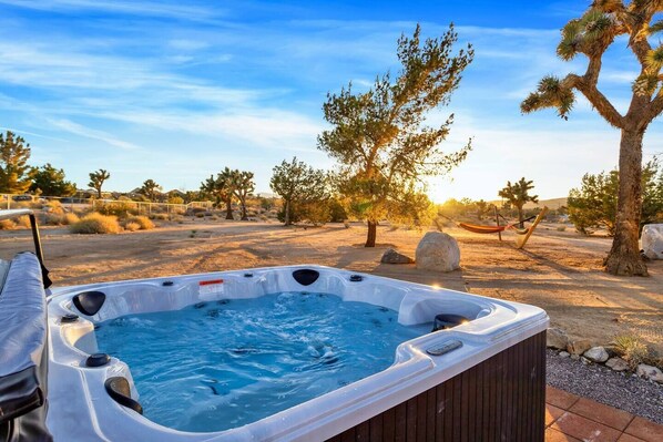 Soak away the stress and relax with lovely desert views