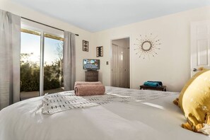 Small television located in bedroom and beautiful desert views.