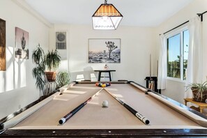 Enjoy a game of pool in this bright and cheery room.