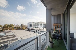 The balcony offers a cosy two-seater table where you can enjoy the leafy views over your morning coffee.
