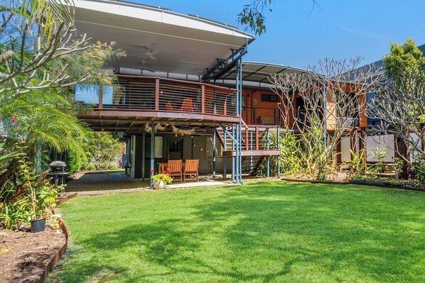 Step outside to the spacious backyard, a sprawling grassed area perfect for various activities. You'll also discover ample outdoor spaces, including the rear deck, front porch, and rear garden – ideal for relaxation and great for families or groups.