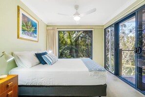 The third bedroom comes with a comfortable queen-sized bed and opens straight to the deck.