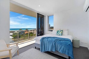 Wake to the sound of the waves from the primary bedroom. It comes with a queen-sized bed, split-system heating and cooling and direct access to the balcony.