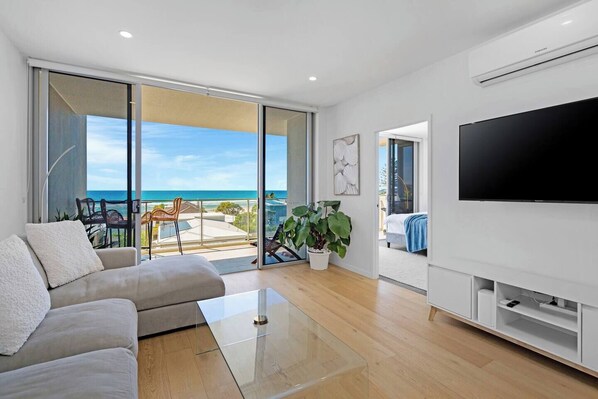 Get comfortable on the lounge while enjoying movie nights at home thanks to the large 60inch wall-mounted TV.