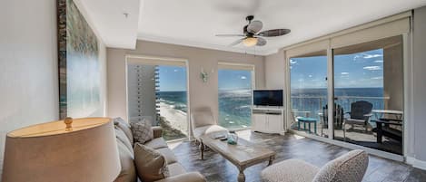 The tastefully decorated living room offers ample, comfortable and NEW seating, flat screen television, and floor-to-ceiling Gulf views. There is also a sliding door to access the unit's private balcony.