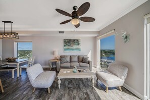 Newly furnished living room features a pull out sofa.