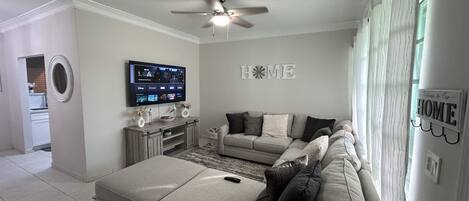 Living room with 65” Smart HDTV
with Netflix, prime video, Disney plus.