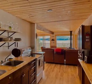 Kitchen comes equipped with dishes, utensils, coffee maker, kettle, blender etc.