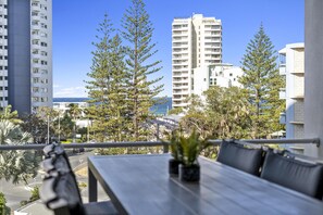 Enjoy your morning coffee in this balcony overlooking the ocean and the city