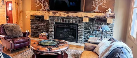 Solitude cabin is the ultimate in cozy cabin vibes.  Oversized leather furniture, open floor plan, and huge stone fireplace make this the perfect gathering spot!
