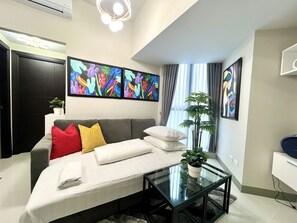 The sofa bed in the living room can accommodate 2 guests.
