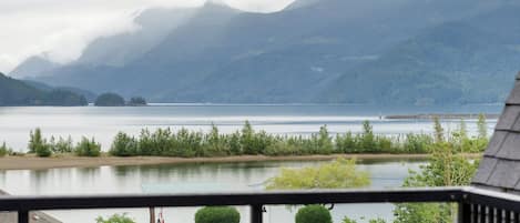A slice of paradise on our balcony: where mountains meet lakes, and tranquility becomes a view