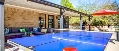 Outdoor ping pong table on the huge back porch