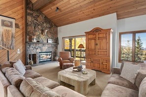Warm yourself by the fire in the Floor to Ceiling Stone Fireplace