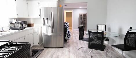 fully-equipped kitchen, including stainless steel appliances brand new 