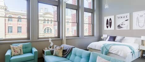 Soaring windows drench the space in natural light—with black-out blinds to encourage a sleep in.