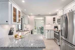 Kitchen Connects to Dining Area and Living Area