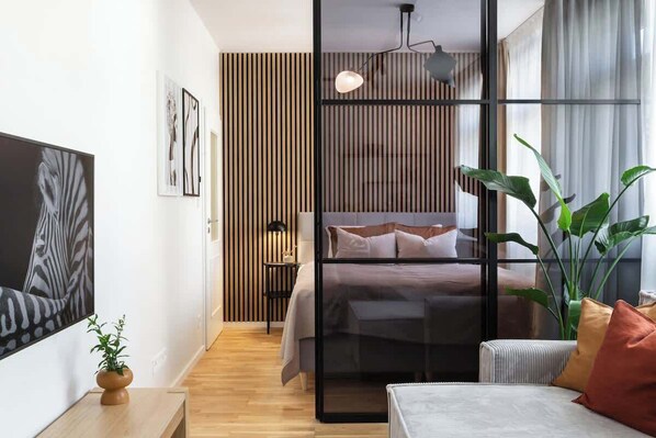 2nd bedroom is separated from the living room with a glass wall and blinds for extra privacy.