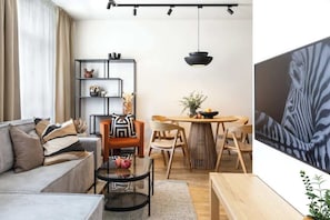 Living room with convertible sofa which can be prepared as an extra bed